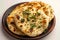 Naan perfection Nan bread served elegantly in an isolated plate