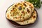 Naan perfection Nan bread served elegantly in an isolated plate