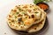 Naan perfection Nan bread served elegantly in an isolated plate