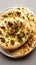 Naan perfection Nan bread served elegantly in an isolated plate