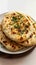 Naan perfection Nan bread served elegantly in an isolated plate