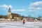 Naantali Church and Naantali holiday center, Finland.People walking on iced seawater