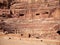The Nabatean amphitheatre in the ancient city of Petra, Jordan. Theatre with row of seats and stairways carved into the side of