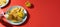 Nachos chips with cheese sauce on blue plate on red background with copy space. Food photo banner format. Concept roadside cafe