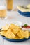 Nachos with salsa and sour cream dips