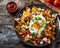 Nachos topped with egg and green onion garnish a savory snack perfect for any occasion, colorful mexican food photo