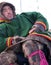 Nadym, Russia - March 11, 2005: Unknown man Nenets closeup, sits