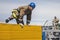 Nadym, Russia - A professional fireman in a special suit jumps over a barrier .Regional fire-fighting in the