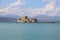 Nafplio, Peloponnese, Greece. Bourtzi castle and mountain landscape in pastel colors.