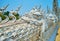 Naga serpents on Bridge of Rebirth Cycle, White Temple, Chiang Rai, Thailand