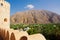 Nahkal Fort and oasis of date palms under the mountain Oman