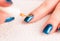 Nail art - painting gold stripes on dark blue base polish