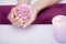 Nail Care. Closeup Of Beautiful Woman Hands With Natural Nails In Beauty Salon. Female Soaking Fingernails In Transparent Glass Bo