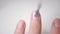 Nail close-up. Use a brush to apply a clear varnish on the nail plate. Applying vitamin enamel to the nail. Manicure