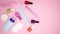 Nail and manicure accessories and tools filling pink background - Stop motion