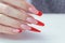 Nail Polish. Art Manicure. Modern style red black gradient Nail Polish. Beauty hands with Stylish Colorful trendy Nails w