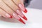 Nail Polish. Art Manicure. Modern style red black gradient Nail Polish. Beauty hands with Stylish Colorful trendy Nails w