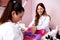 Nail treatment in a nail salon by hands of experienced manicurist