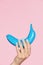 Nails Beauty. Hand With Blue Nails Holding Banana