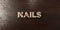 Nails - grungy wooden headline on Maple - 3D rendered royalty free stock image