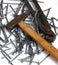 Nails, hammer and pincers on a white background