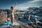 Naked snowboarder girl with snowboard and ski glasses at unusual amazing the Charyn Canyon