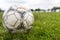 Nakhon Ratchasima, Thailand - October 1 : Muddy soccer ball on a football field in Municipal Stadium Nakhon Ratchasima on October