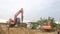 Nakon Pathom, THAILAND - June 28, 2017: At construction site, group of worker and backhoe with a drill device drilling deep hole 2