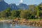 Nam Song River landscape with a speedboat in Vang Vieng, Laos