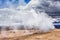 Namafjall Hverir geothermal area in Iceland. Stunning landscape of sulfur valley with smoking fumaroles and blue cloudy sky