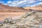 Namafjall Hverir geothermal area in Iceland. Stunning landscape of sulfur valley with smoking fumaroles and blue cloudy sky