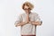Namaste sensei. Portrait of attractive cute and charismatic european blond woman in glasses with short haircut nodding
