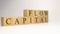 The name capital flow was created from wooden letter cubes.