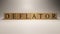 The name deflator was created from wooden letter cubes. Economics and finance.