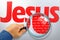 The name JESUS under observation with magnifying glass