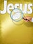 The name JESUS under observation with magnifying glass