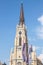 The Name of Mary Church, also known as Novi Sad catholic cathedral on a sunny afternoon with flags of Voivodina province, Serbia