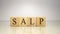 The name Salp was created from wooden letter cubes. Sea creatures and food.