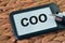 Name tag written with text COO stands for Chief Operating Officer