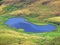 Nameless small alpine lakes and natural mini ponds on the mountain plateaus in the Uri Alps mountain massif, Kerns - Switzerland