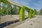 Namestie hrdinov square in Levice with columns with green creeping plant