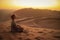 Namib Desert, in the Namib-Nacluft National Park in Namibia. Sossusvlei. Young woman tourist doing yoga and relaxation