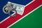 Namibia flag with handcuffs and a bundle of dollars. The concept of breaking the law and thieves crimes