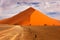 Namibia landscape. Big orange dune with blue sky and clouds, Sossusvlei, Namib desert, Namibia, Southern Africa. Red sand, biggest
