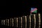 Namibian flag with lot of coins on black