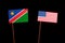 Namibian flag with USA flag isolated on black