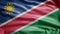 Namibian flag waving in the wind. Namibia banner blowing soft silk