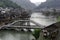 The Nanhua Bridge arched beneath a center tower provides river crossing in Fenghuang Ancient City in Tibet, China