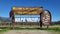 NAPA VALLEY CALIFORNIA - FEB 6,  2022: Wooden welcome sign for Napa Valley set before rows of grape vines. Napa Valley is widely c