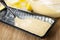 Napkin, bowl with dough, form greased butter with spoon and dough for muffin on wooden table